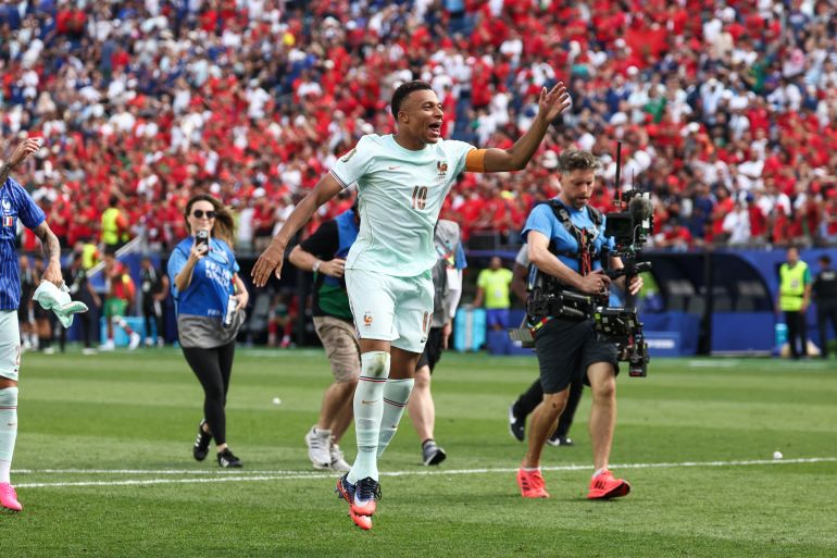 Kylian Mbappe reacts.
