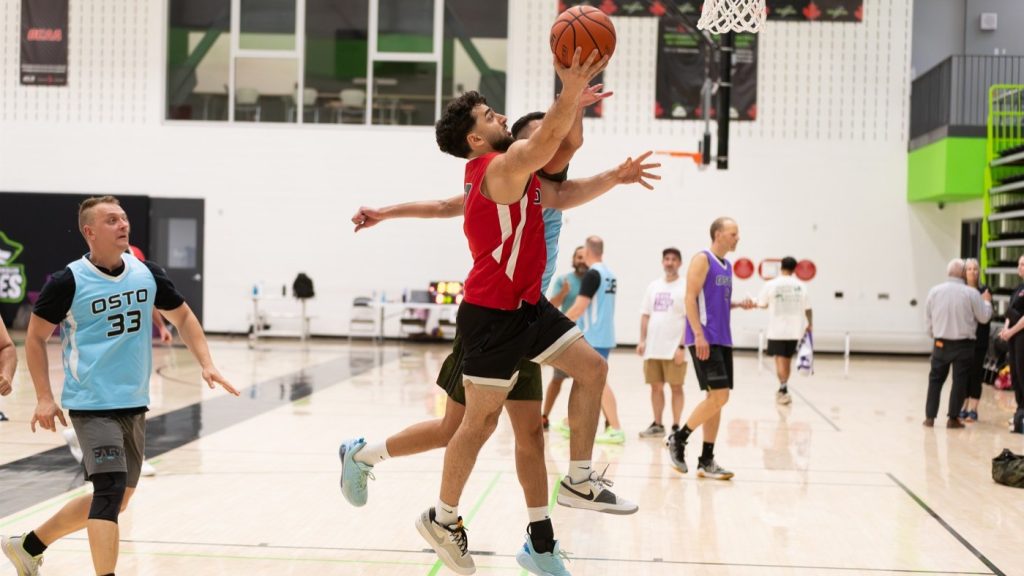 Players battle for every basket during a fast-paced matchup at the Ottawa Summer Tip-Off charity tournament.