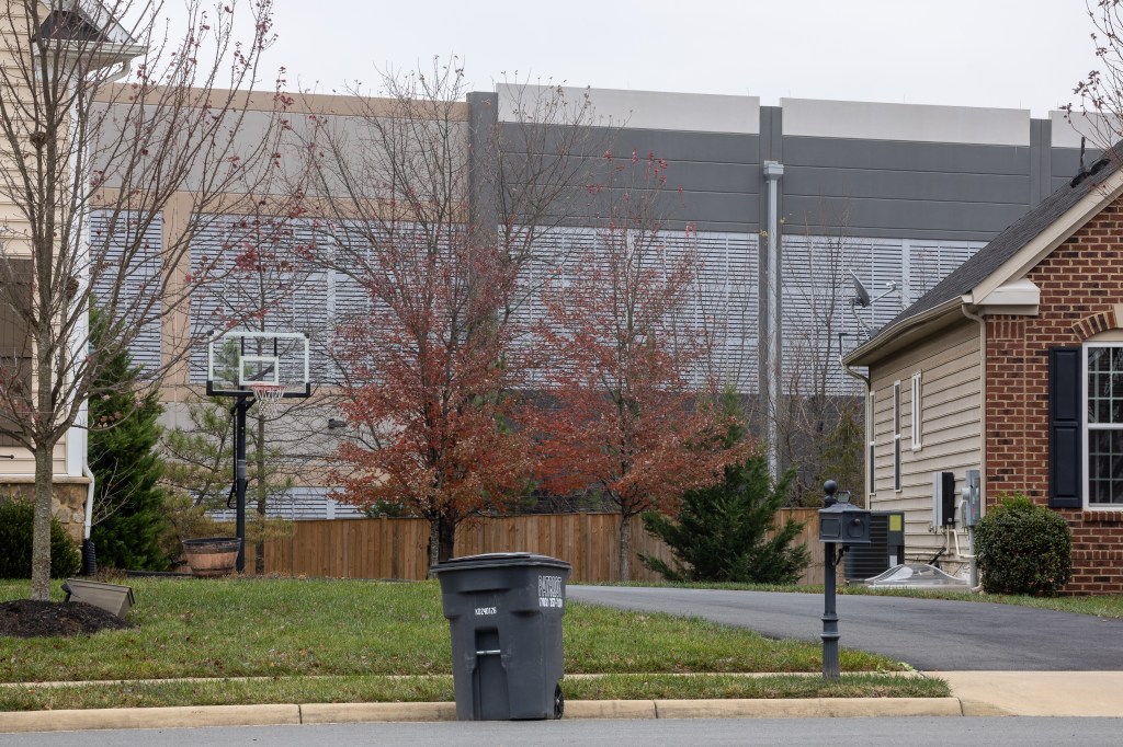 An Amazon data center is seen near homes in Stone Ridge, Va., Nov. 20, 2025.