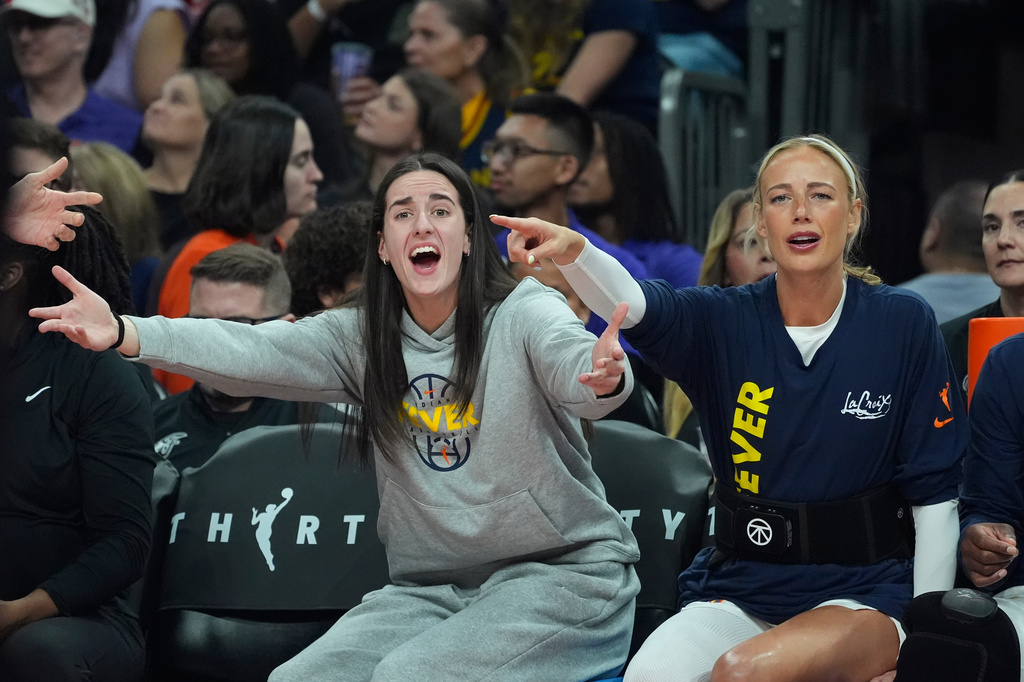 Indiana Fever's Caitlin Clark, left, and Sophie Cunningham argue with officials during the first half of a WNBA basketball game against the Phoenix Mercury, Thursday, July 9, 2026, in Phoenix.
