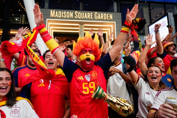 Spain fans gather for a rally on the eve of the World Cup final soccer match in New York's Times Square, Saturday, July 18, 2026 (AP Photo/Yuki Iwamura)