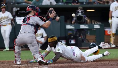 Boston Red Sox catcher Connor Wong, left, attempts to get Athletics' Lawrence Butler (4) out at home plate during the sixth inning of a baseball game Thursday, July 30, 2026, in West Sacramento, Calif. (AP Photo/Sara Nevis)