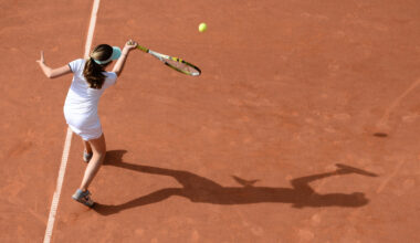 A young woman plays tennis in the light of the low-hanging sun and casts a long shadow in Hamburg, Germany, 09 June 2016. Photo by: Daniel Reinhardt/picture-alliance/dpa/AP Images