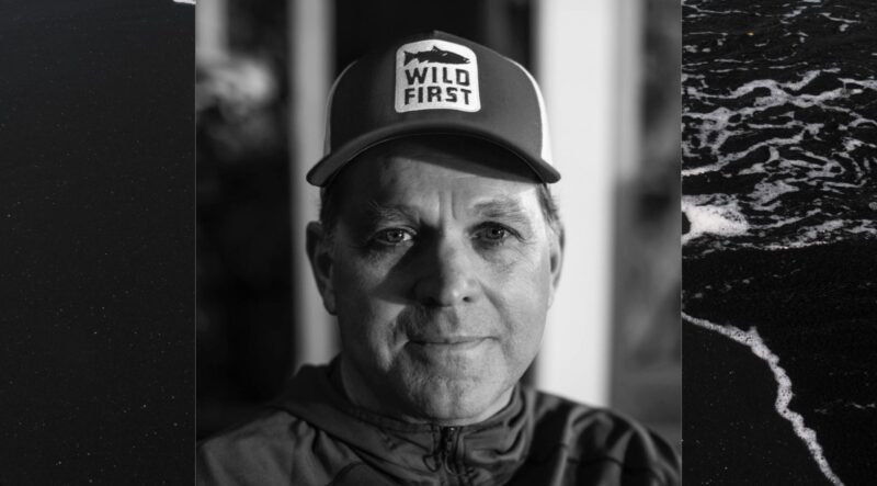 Man wearing cap, focused expression.