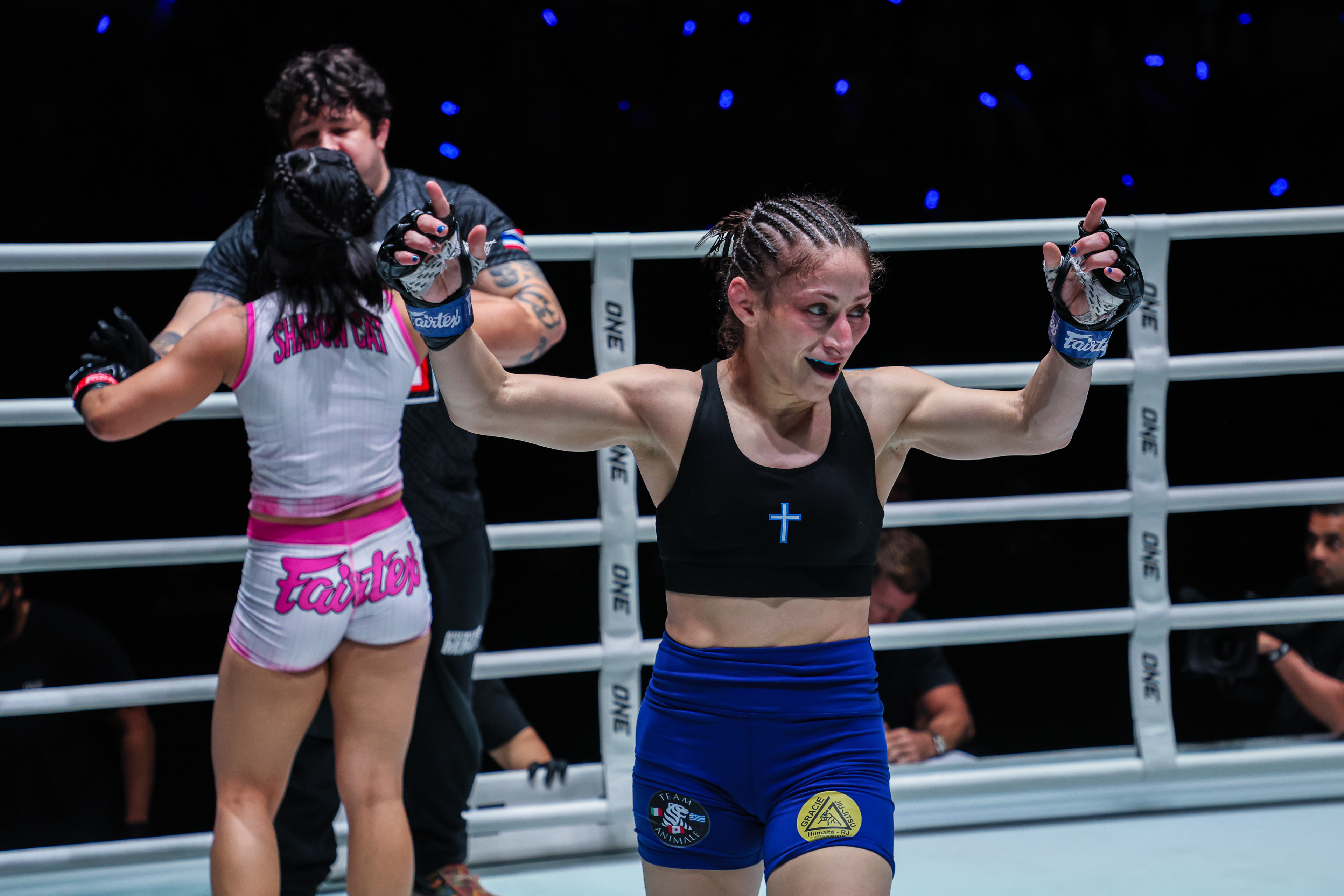 Anastasia Nikolakakos celebrates her win in the ring over Jihin Radzuan
