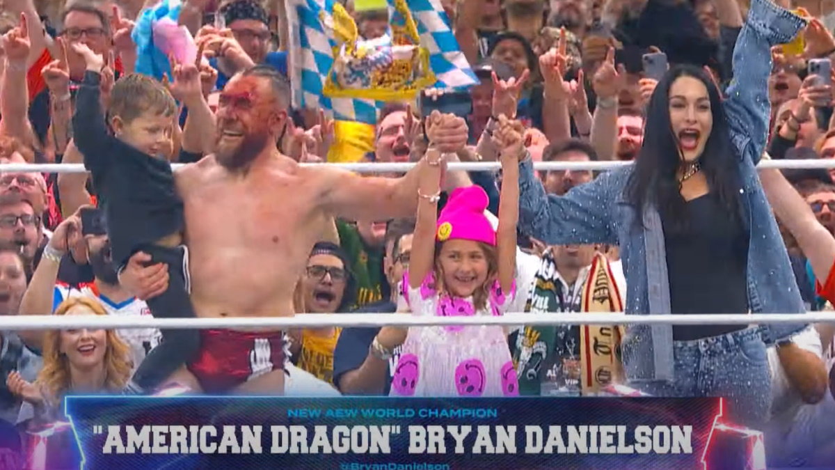 Bryan Danielson with Brie Bella and their children