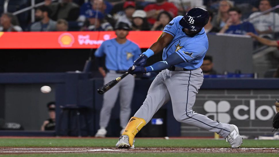 Tampa Bay Rays' Cedric Mullins (31) hits a double against the Toronto Blue Jays during the first inning of a baseball game in Toronto on Tuesday, July 21, 2026. (Jon Blacker/The Canadian Press via AP)