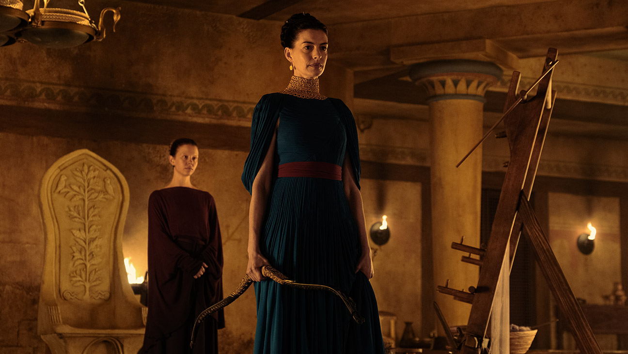 L to R: Mia Goth is Melantho and Anne Hathaway is Penelope in The Odyssey