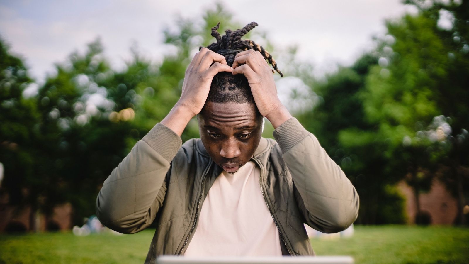 A man with his hands on his head