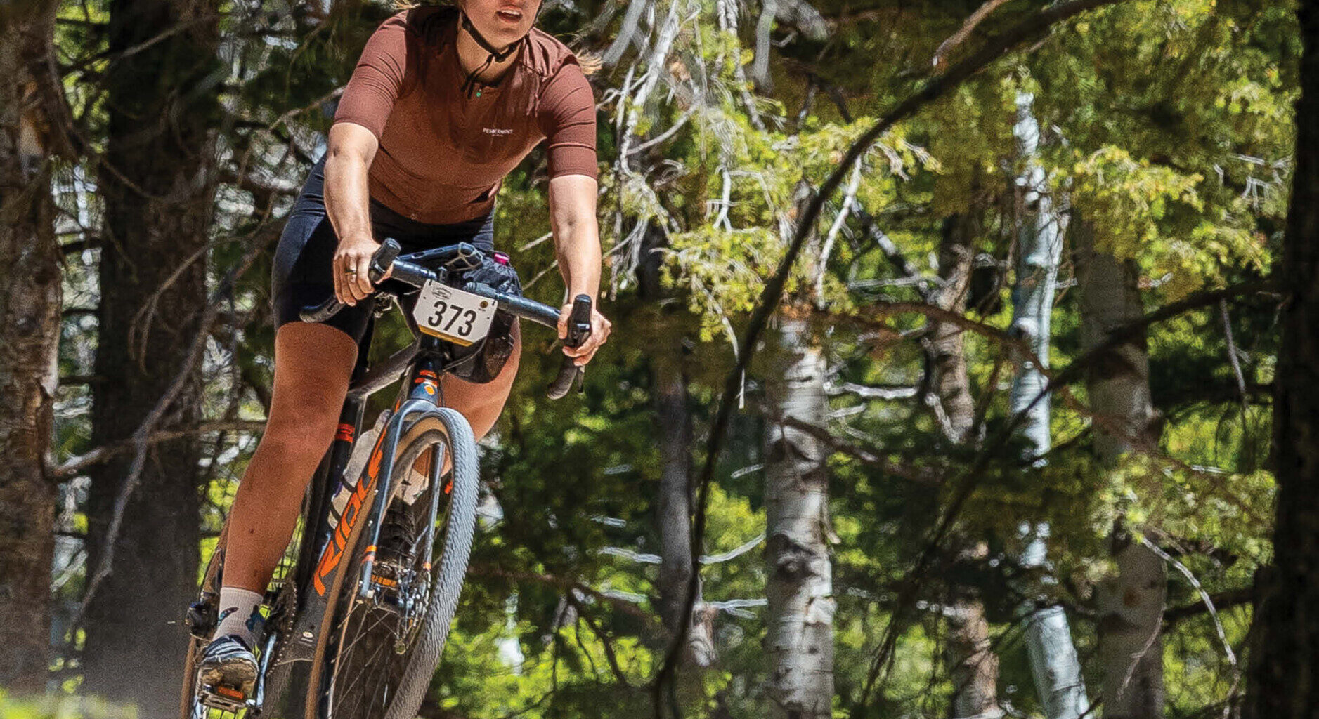 Cycling West Summer 2026 Cover Photo: Clara Hatcher racing in the 2026 Dirty Dino held on June 13, 2026 in Vernal, Utah. Photo by Kris Braun, Utah Gravel Series, https://krisbraun.format.com/utah-gravel-series
