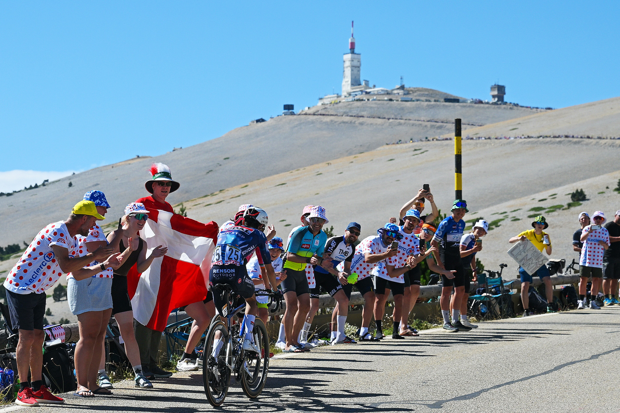 MONT VENTOUX, FRANCE - JULY 22: Valentin Paret-Peintre of France and Team Soudal Quick-Step competes climbing to the Mont Ventoux (1902m) while fans cheers during the 112th Tour de France 2025, Stage 16 a 171.5km stage from Montpellier to Mont Ventoux 1902m / #UCIWT / on July 22, 2025 in Mont Ventoux, France. (Photo by Dario Belingheri/Getty Images)