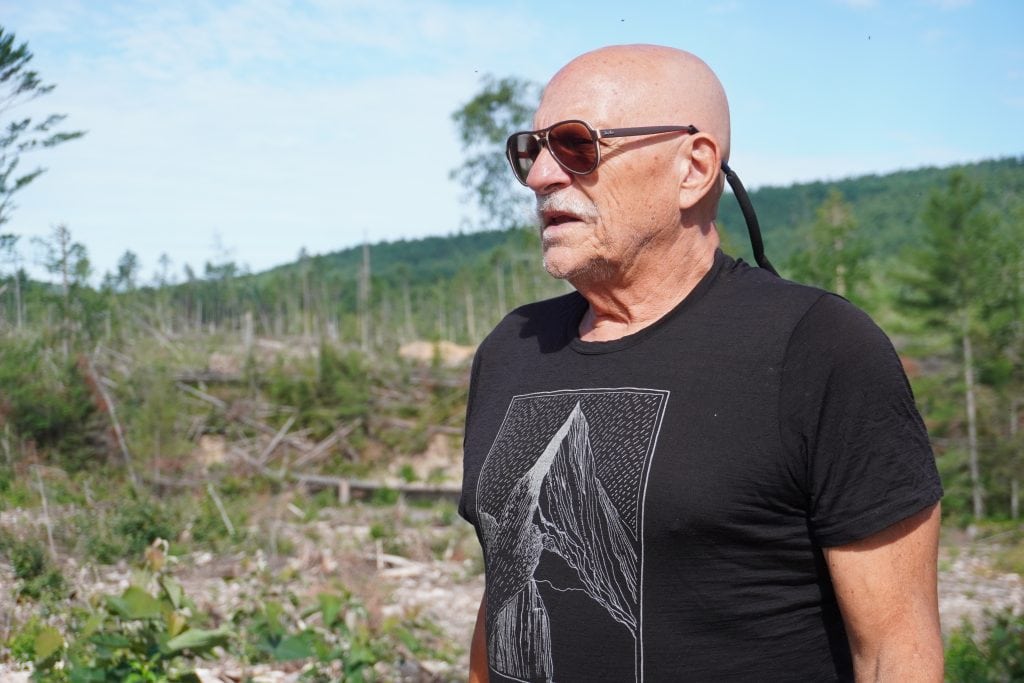 "Back Roads Bill" Steer, general manager of the Canadian Ecology Centre, stands in front of the storm damage at Samuel de Champlain Provincial Park.