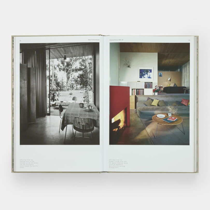 An open book displays two pages with photographs of modern home interiors; the left page shows a dining area, and the right page shows a living room with a fireplace.