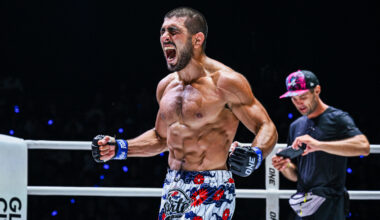 MMA fighter Elbek Alyshov celebrates his win in the ring