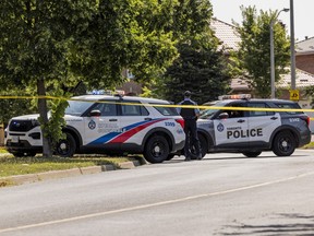 Toronto Police at the scene of the fatal shooting of a woman in North Etobicoke on Friday, July 24, 2026.