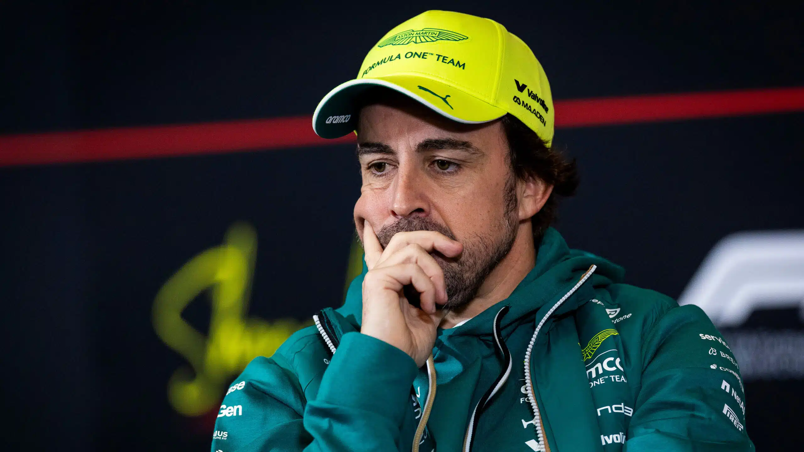 Fernando Alonso leans on his hand in 2026 F1 press conference
