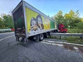 Commercial truck stuck on Forks of the Credit Road in Caledon.