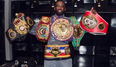 Terence Crawford poses with four championship belts after defeating Canelo Alvarez on September 13, holding the WBA, WBO, IBF, and Ring titles.