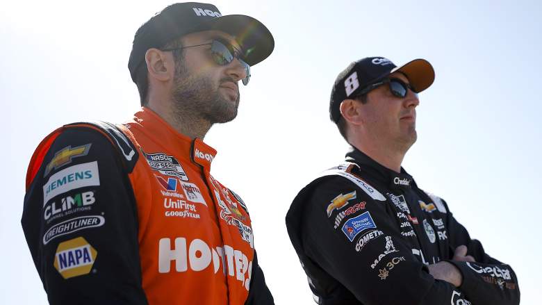 Chase Elliott and Kyle Busch stand together before NASCAR Cup Series qualifying at Atlanta Motor Speedway.