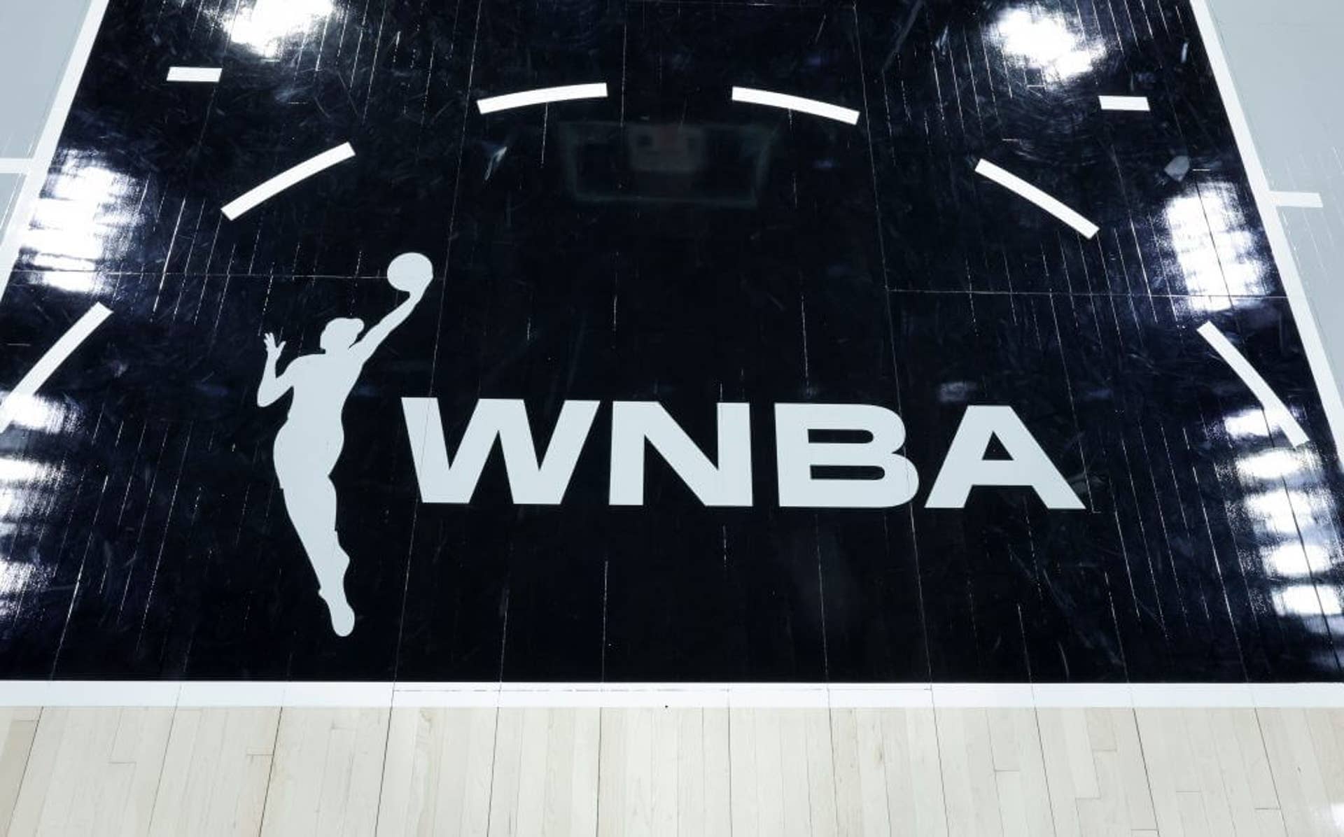 A WNBA logo is shown on the court.