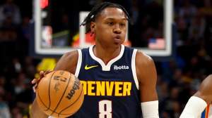 Peyton Watson #8 of the Denver Nuggets was spotted talking with Lakers Gm Rob Pelinka.