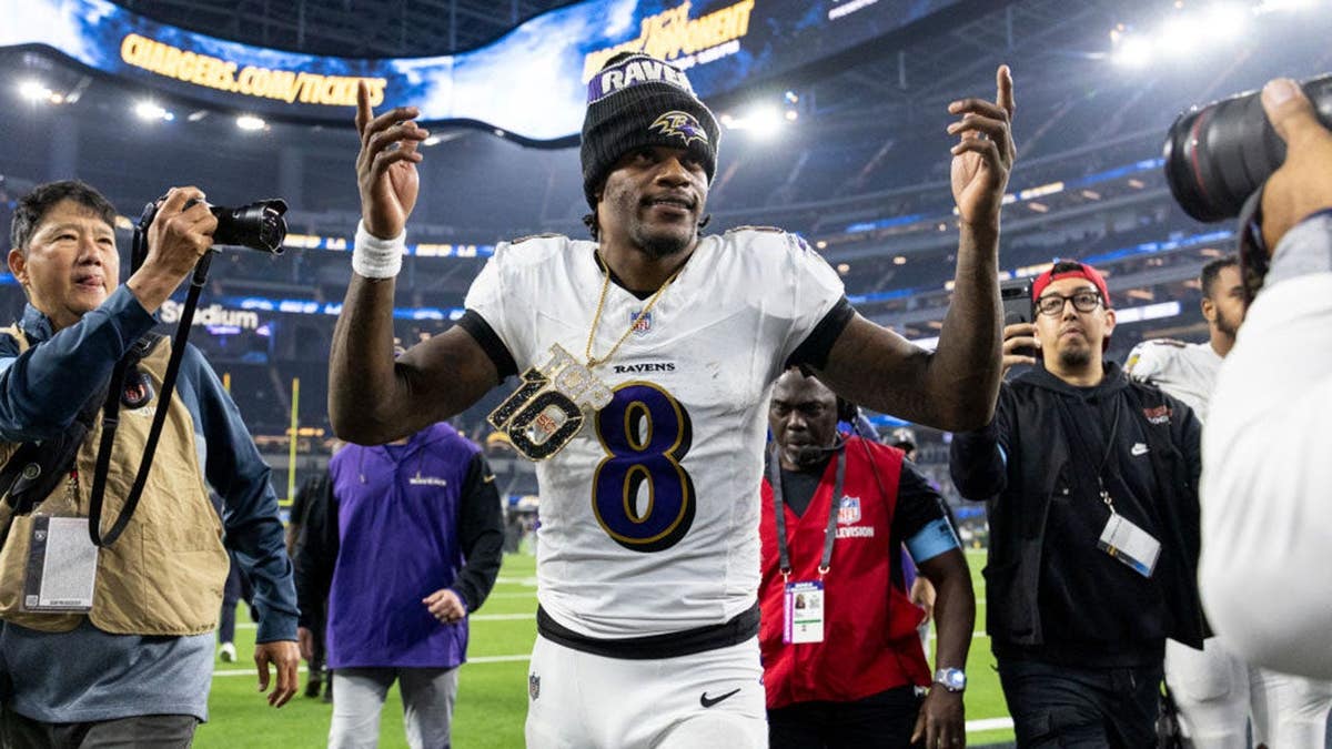 Lamar Jackson reacts as he runs off the field at SoFi Stadium.