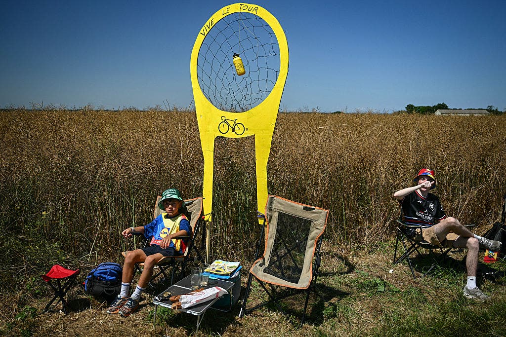 Tour de France spectators waiting for bottles.