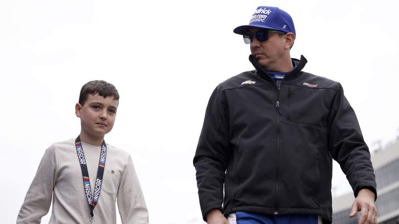 Kyle Busch walks alongside son Brexton Busch before a NASCAR Craftsman Truck Series race at EchoPark Speedway in February 2026.