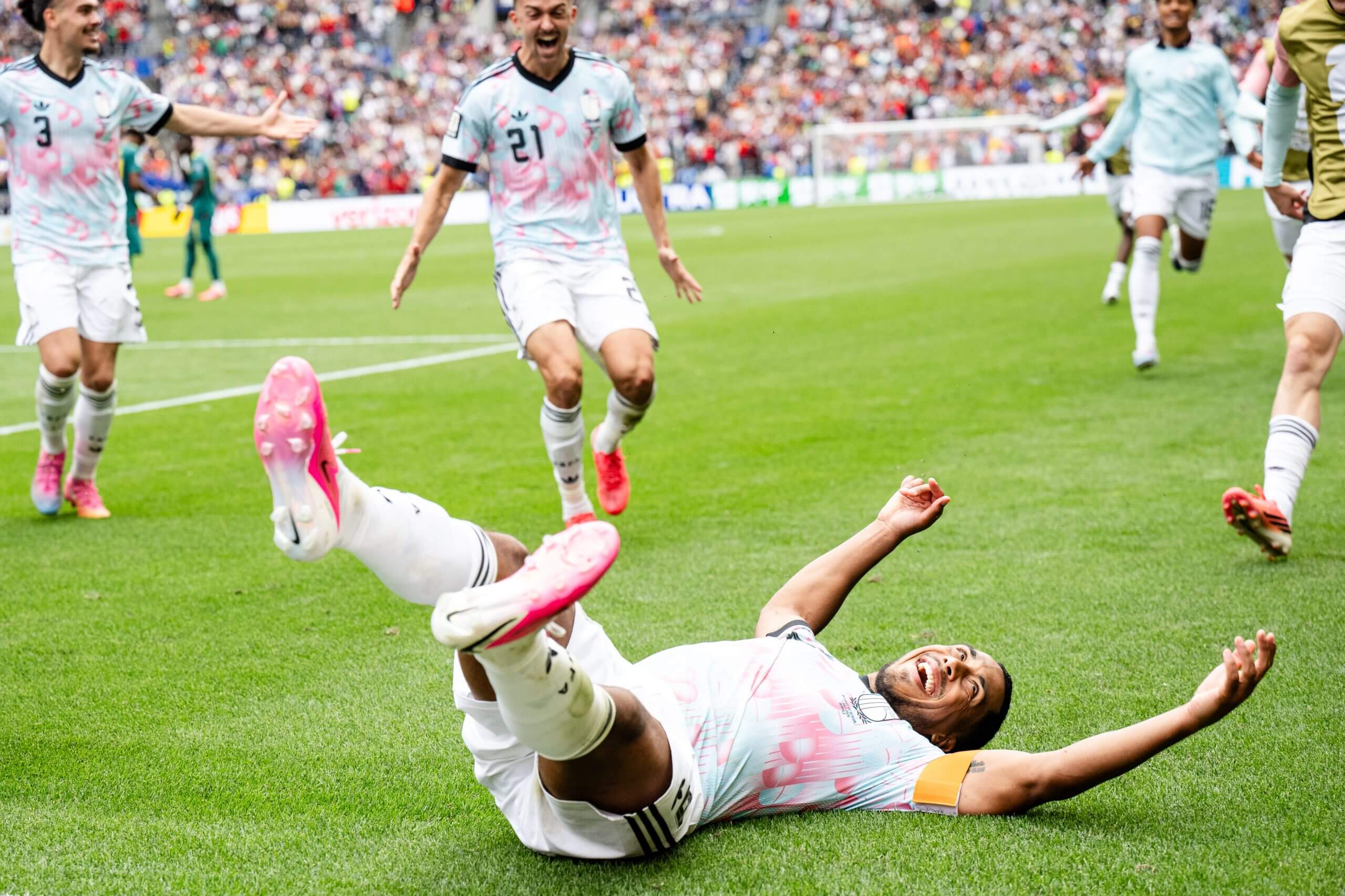 Youri Tielemans flops to the ground as he celebrates scoring Belgium's extra-time winner against Senegal