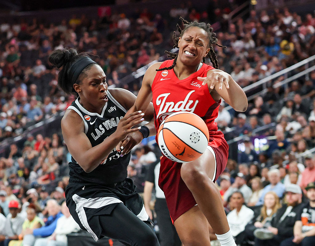 LAS VEGAS, NEVADA - JULY 05: Kelsey Mitchell #0 of the Indiana Fever is fouled by Chelsea Gray #12 of the Las Vegas Aces in the fourth quarter of their game at T-Mobile Arena on July 05, 2026 in Las Vegas, Nevada. The Fever defeated the Aces 84-68. NOTE TO USER: User expressly acknowledges and agrees that, by downloading and or using this photograph, User is consenting to the terms and conditions of the Getty Images License Agreement. (Photo by Ethan Miller/Getty Images)
