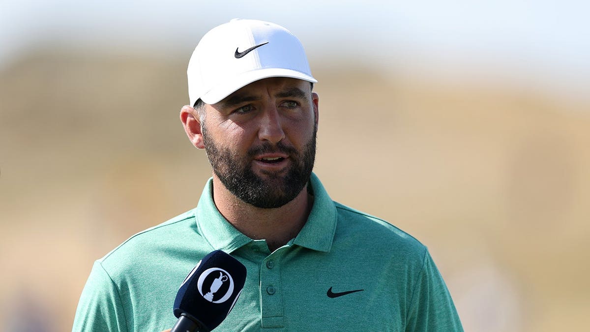 Scottie Scheffler is interviewed on the ninth hole in Southport, England.
