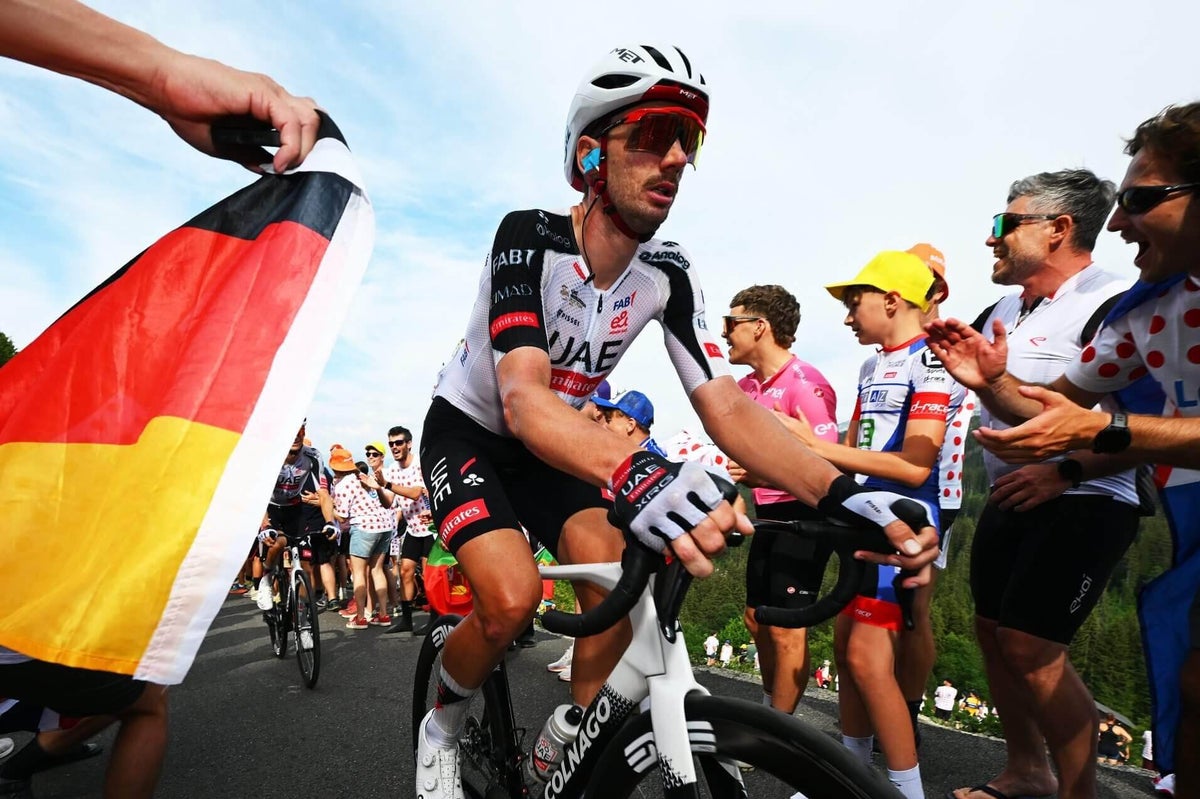 American cyclist Brandon McNulty knocked off bike by car before Tour de France time trial