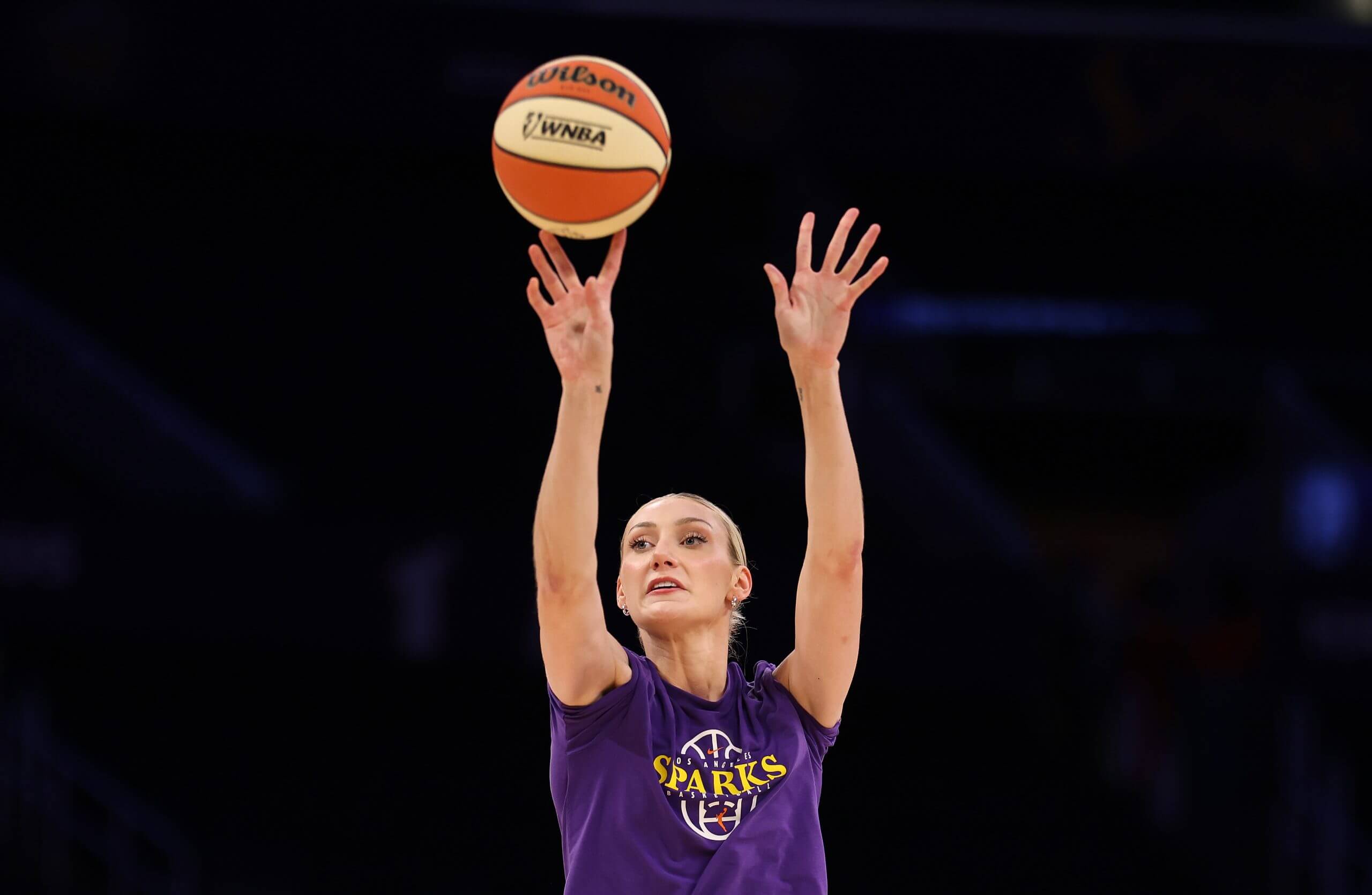 Cameron Brink shoots during warmup.