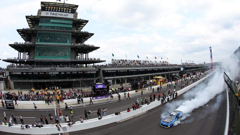 Corey Heim celebrates with a burnout after winning the Brickyard 400 at Indianapolis Motor Speedway.