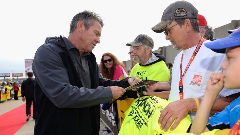 Actor Dennis Quaid greets NASCAR fans before a race at Texas Motor Speedway.