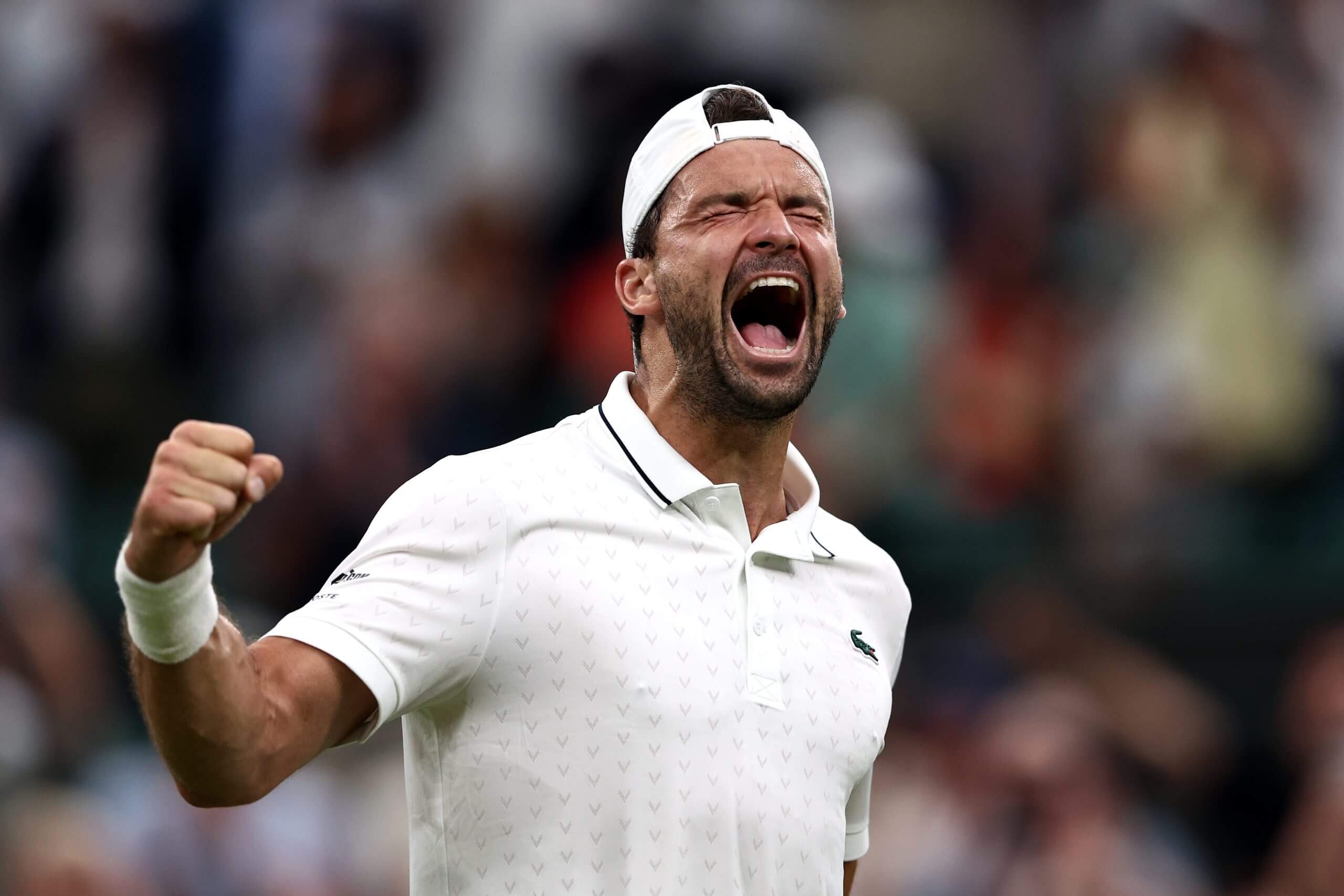 Grigor Dimitrov roars in celebration.