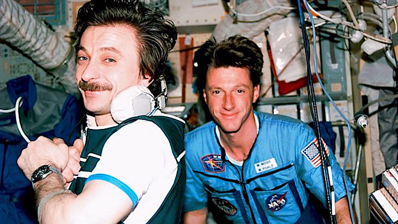 Two astronauts aboard a space station