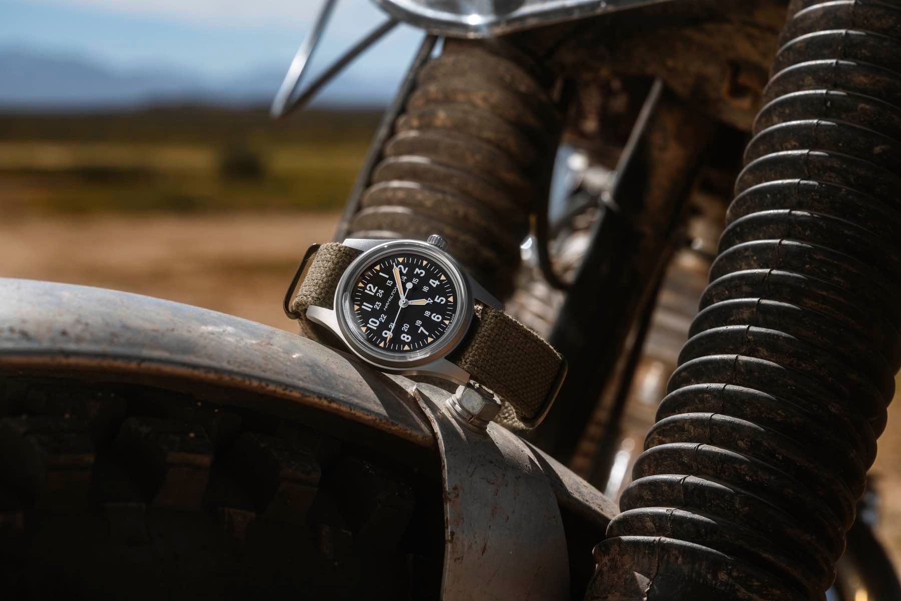 Hamilton Khaki Field Mechanical 36mm H69399930 on its side on top of motorcycle mudguard
