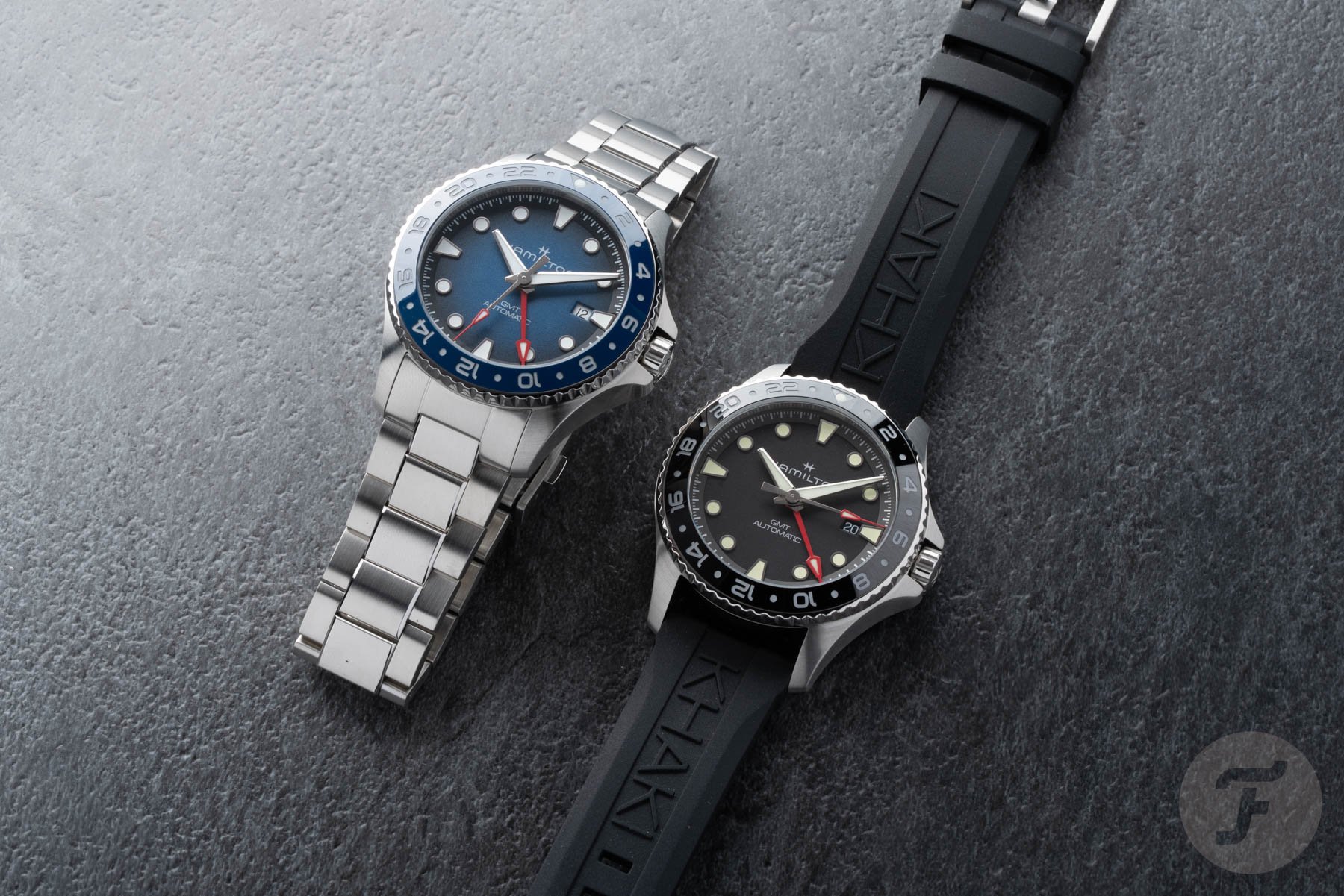Hamilton Khaki Navy Scuba Auto GMT models side by side, flat-lay
