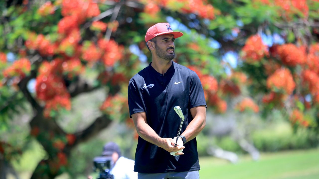 Marcus Mariota readied to take a tee shot from the No. 3 hole at Pearl at Kalauao during the 10th Motiv8 Foundation Golf Tournament on Monday.