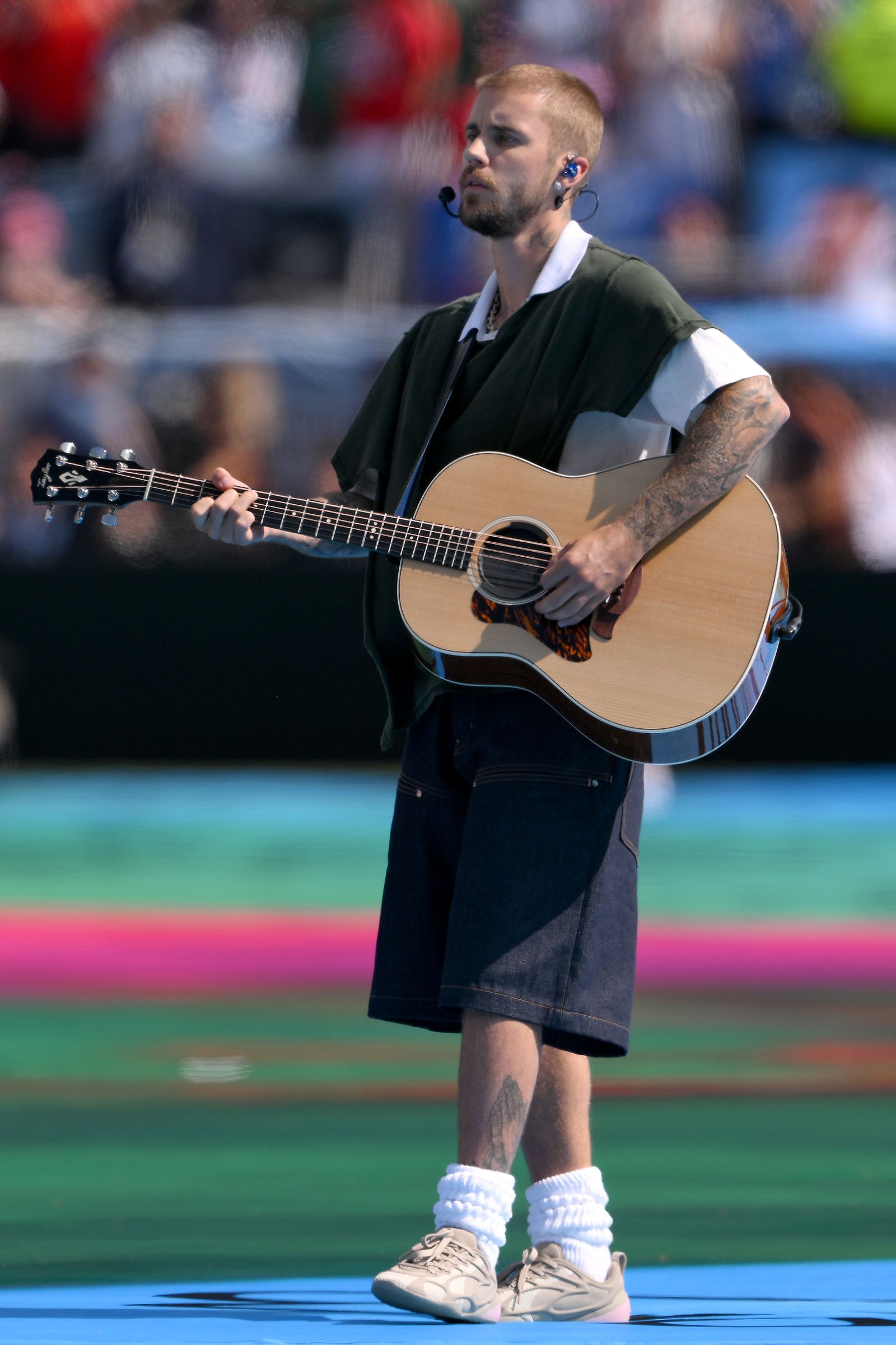 Image may contain Justin Bieber Guitar Musical Instrument Adult Person Performer Solo Performance and Guitarist
