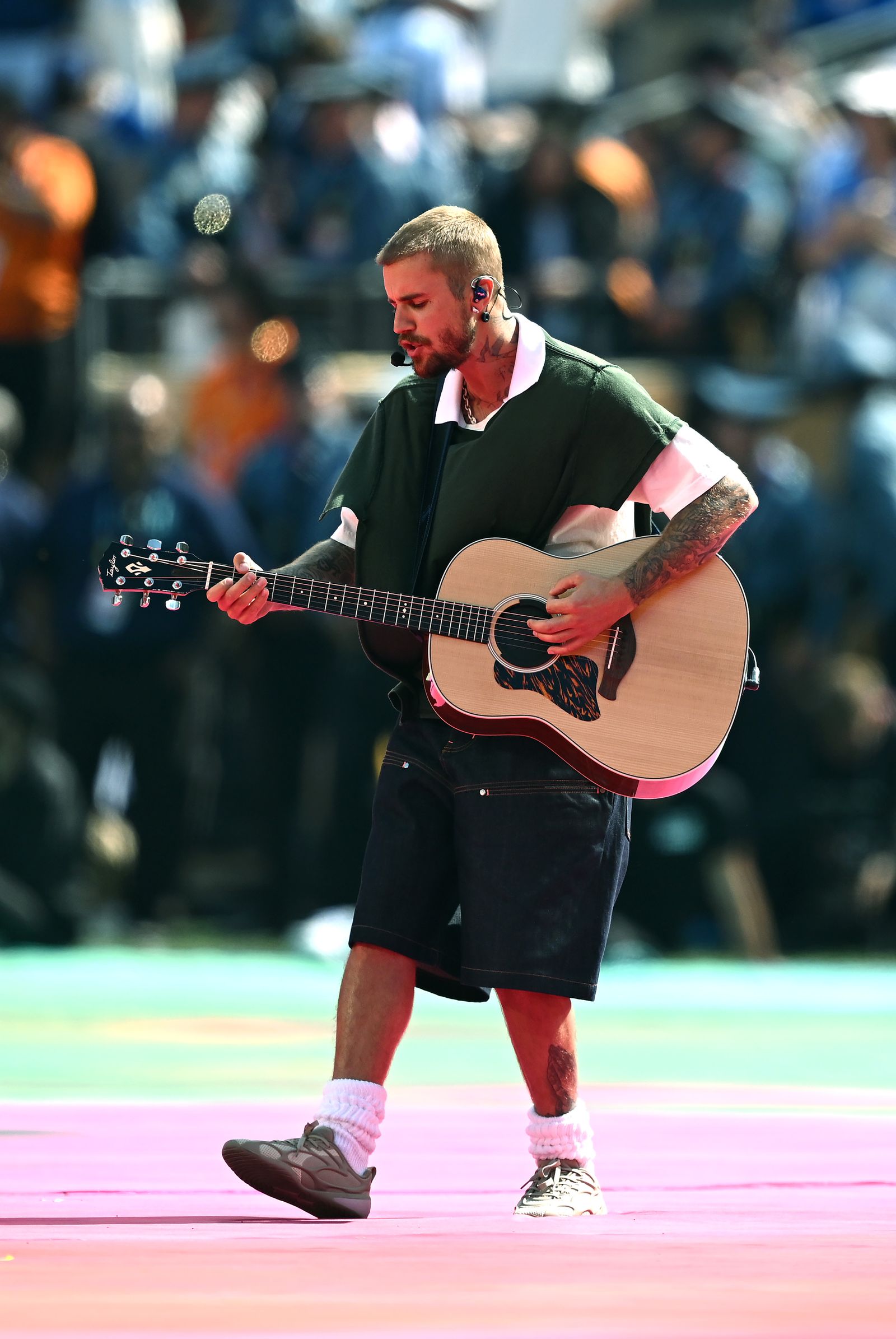 Image may contain Justin Bieber Guitar Musical Instrument Adult Person Performer Solo Performance and Guitarist