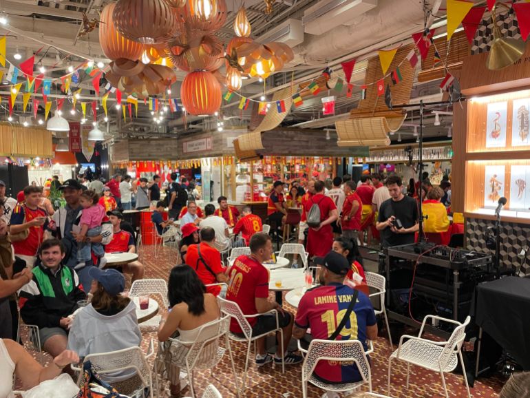 Spanish fans are seen at Mercado Little Spain in Manhattan