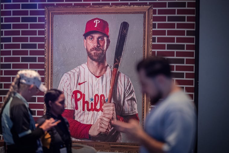 A painted portrait of Bryce Harper is displayed as part of an exhibit Thursday, July 9, 2026, during preparations for the 2026 MLB All-Star Village inside the Pennsylvania Convention Center in Philadelphia. The All-Star Village opens Saturday and runs through Tuesday ahead of the 2026 MLB All-Star Game.