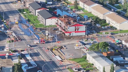 An aerial view of an apartment building at 82 Street and 132 Avenue in Edmonton the morning after a fatal fire on July 13, 2026. (Sean McClune / CTV News Edmonton)