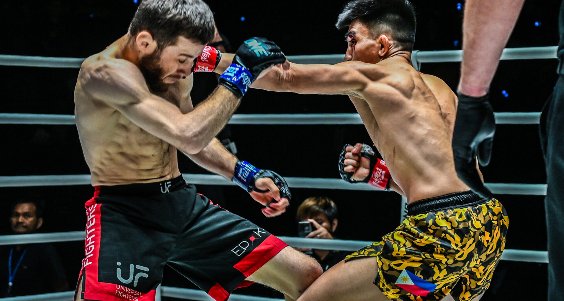 Joshua Pacio punches Mansur Malachiev in their first MMA fight