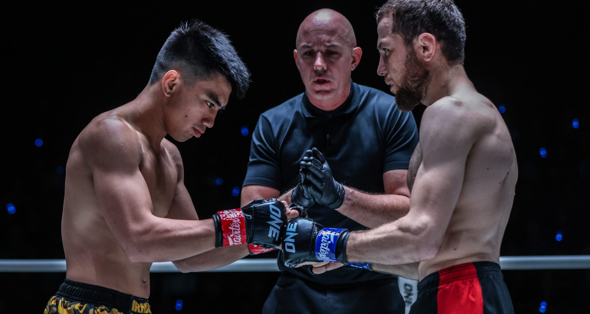 Joshua Pacio and Mansur Malachiev touch gloves before their fight at ONE Fight Night 15