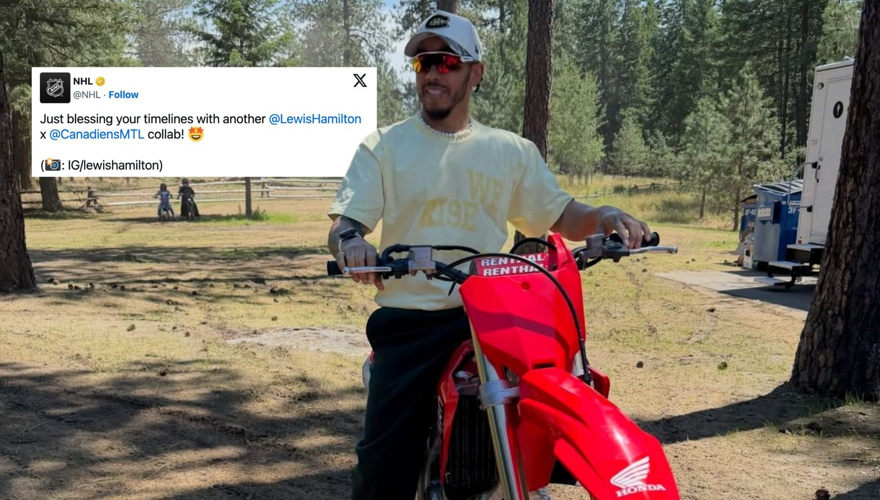 Lewis Hamilton wearing a Montreal Canadiens hat on a motorcycle in the woods.