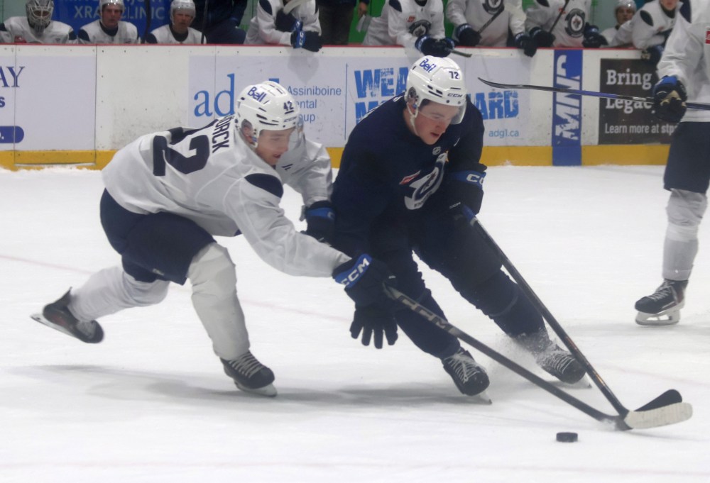 Owen Martin battles with 2026 Winnipeg Jets first rounder Viggo Bjorck during the closing scrimmage July 3 at the NHL team's development camp. (Cassidy Dankochik The Carillon)