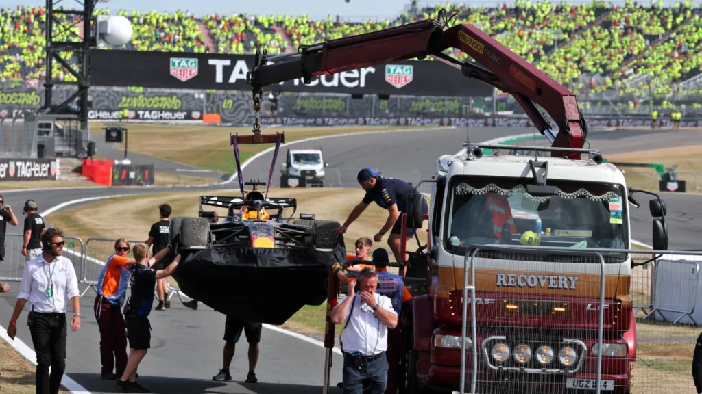 The wreckage of Max Verstappen's Red Bull was towed away after the British GP